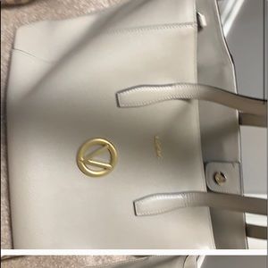 Authentic Valentino - shows some wear.